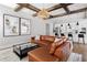 Comfortable living room open to kitchen boasts a leather sofa, glass table, and modern decor at 2792 Mathews Se St, Smyrna, GA 30080