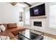 Cozy living room features a fireplace, wet bar, and leather sofa at 2792 Mathews Se St, Smyrna, GA 30080