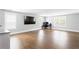Bright, spacious living room features hardwood floors and large windows, offering a flexible living space at 2792 Mathews Se St, Smyrna, GA 30080
