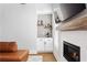 Charming living room with stone fireplace, custom shelves, wet bar, and comfortable leather couch at 2792 Mathews Se St, Smyrna, GA 30080