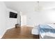 Bright main bedroom featuring wood floors, a stylish chandelier, and a cozy sitting area at 2792 Mathews Se St, Smyrna, GA 30080