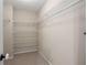 Walk-in closet with multiple shelves for storing clothes and organizing personal belongings at 3626 Lantern Crest Cv, Scottdale, GA 30079