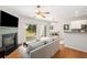 Cozy living room with fireplace and sliding glass doors leading to the backyard at 3626 Lantern Crest Cv, Scottdale, GA 30079