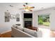 Comfortable living room featuring a fireplace, hardwood floors, and sliding glass doors at 3626 Lantern Crest Cv, Scottdale, GA 30079