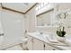 Clean bathroom featuring a tub and shower combination, vanity, and decorative accents at 909 Wentworth Ct, Alpharetta, GA 30022