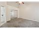 A spacious bedroom with large closet and view into an adjacent bathroom at 909 Wentworth Ct, Alpharetta, GA 30022
