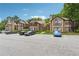 Exterior view of townhomes featuring large windows, balconies, and dedicated parking spaces at 909 Wentworth Ct, Alpharetta, GA 30022