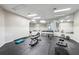 Gym with workout equipment and large mirrors covering most of the walls at 909 Wentworth Ct, Alpharetta, GA 30022