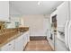 Bright kitchen with a clean design, white cabinets, and spacious countertops at 909 Wentworth Ct, Alpharetta, GA 30022