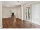 Living room showcasing hardwood floors, french doors, and access to an outdoor patio at 909 Wentworth Ct, Alpharetta, GA 30022