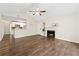Living room features hardwood floors, fireplace, and an open layout with views into the kitchen at 909 Wentworth Ct, Alpharetta, GA 30022