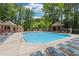 Large community pool with lots of lounge chairs and a gazebo in a lush setting at 909 Wentworth Ct, Alpharetta, GA 30022