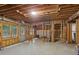Unfinished basement with exposed ceiling and ductwork, a walkout door, and natural light at 1029 Ector Nw Dr, Kennesaw, GA 30152