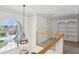 Hallway with chandelier, arched window, and built-in shelves, offering a bright and elegant space at 1029 Ector Nw Dr, Kennesaw, GA 30152