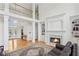 Bright living room with a fireplace, hardwood floors, and natural light at 1029 Ector Nw Dr, Kennesaw, GA 30152