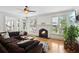 Cozy living room showcasing a fireplace, large windows, and comfortable seating at 1029 Ector Nw Dr, Kennesaw, GA 30152