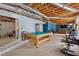 Basement with pool table, gym equipment, and ample space for recreation at 2372 Wilshire Way, Douglasville, GA 30135