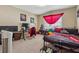 Bedroom featuring gaming decor, a black metal bedframe, and a desk at 2372 Wilshire Way, Douglasville, GA 30135