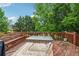 Wooden deck overlooking private backyard with lush landscaping at 2372 Wilshire Way, Douglasville, GA 30135