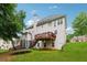 Back exterior with a wooden deck, side stairs, and yard at 2372 Wilshire Way, Douglasville, GA 30135