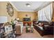 Comfortable living room with plush sofas, glass table, a fish tank, decorative mirror and a large window at 2372 Wilshire Way, Douglasville, GA 30135