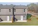 Townhome with a green lawn and backyard patio at 247 Ivey Ter, Temple, GA 30179