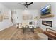 Inviting living room with fireplace, mounted TV, modern furniture, and chic decor at 247 Ivey Ter, Temple, GA 30179