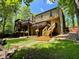 Expansive backyard featuring a multi-level deck and lush green lawn, ideal for outdoor activities and enjoying nature at 2694 Tritt Springs Ne Dr, Marietta, GA 30062
