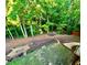 The spacious backyard features mature trees, a fire pit, and detailed landscaping at 2694 Tritt Springs Ne Dr, Marietta, GA 30062