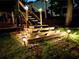 Backyard stairs with built-in lighting lead to an upper level and landscaped backyard at 2694 Tritt Springs Ne Dr, Marietta, GA 30062