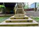 Backyard stairs with built-in lighting lead to an upper level at 2694 Tritt Springs Ne Dr, Marietta, GA 30062