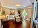 Cozy dining room featuring hardwood floors, a unique diamond-shaped window, and seating for four at 2694 Tritt Springs Ne Dr, Marietta, GA 30062