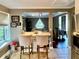 Bright kitchen bar with two chairs overlooking the home's open floor plan and stainless steel appliances at 2694 Tritt Springs Ne Dr, Marietta, GA 30062