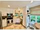 Bright kitchen features stainless steel appliances, granite countertops, and abundant natural light at 2694 Tritt Springs Ne Dr, Marietta, GA 30062