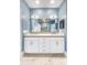 Stylish bathroom featuring a double vanity, a large mirror, and a linen cabinet at 312 Stonemont Dr, Atlanta, GA 30305