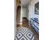 Inviting entryway with hardwood floors, geometric rug, staircase, and stylish console table at 312 Stonemont Dr, Atlanta, GA 30305