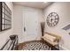 Cozy entryway featuring a geometric rug, bench, decorative mirror, and modern accents at 312 Stonemont Dr, Atlanta, GA 30305