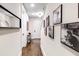 Hallway with dark hardwood flooring and decorative posters at 312 Stonemont Dr, Atlanta, GA 30305