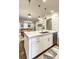 Open-concept kitchen with island seating, stainless steel appliances, and modern lighting fixtures at 312 Stonemont Dr, Atlanta, GA 30305