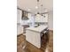 Modern kitchen featuring white cabinets, stainless steel appliances, and a spacious island at 312 Stonemont Dr, Atlanta, GA 30305