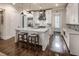 Bright, modern kitchen with a large island, white cabinetry, and hardwood floors at 312 Stonemont Dr, Atlanta, GA 30305