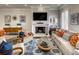 Well-lit living room with comfortable seating, a fireplace, and stylish decor at 312 Stonemont Dr, Atlanta, GA 30305