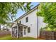 Well-maintained backyard with lush green grass, wood fence and an inviting screened in porch at 3123 Cedar St, Scottdale, GA 30079