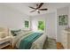 Inviting bedroom with hardwood floors, large windows, and a comfortable queen-size bed at 3123 Cedar St, Scottdale, GA 30079