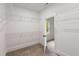 Bright walk-in closet with carpeted floor and white wire shelving for optimal storage at 3123 Cedar St, Scottdale, GA 30079
