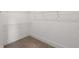 Walk-in closet featuring adjustable shelving, carpet, and a simple minimalist design at 3123 Cedar St, Scottdale, GA 30079