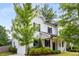 Beautiful two-story home featuring white siding, black shutters, and a well-manicured front yard at 3123 Cedar St, Scottdale, GA 30079