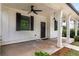 Inviting front porch with classic columns, dark accents, and stylish lighting at 3123 Cedar St, Scottdale, GA 30079