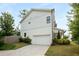 Spacious garage with a long driveway and well-maintained landscaping at 3123 Cedar St, Scottdale, GA 30079
