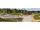 A park setting with sidewalks, landscaping, and shaded seating areas at 3123 Cedar St, Scottdale, GA 30079